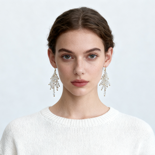 Handmade crystal fringe drop earrings on cream background