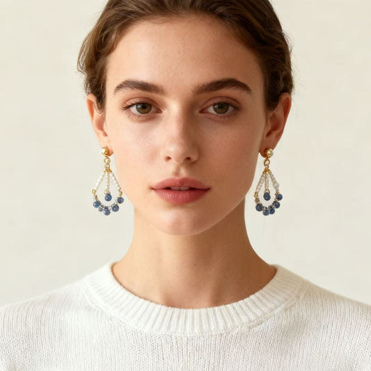 Handmade pearl and blue beaded drop earrings worn on model