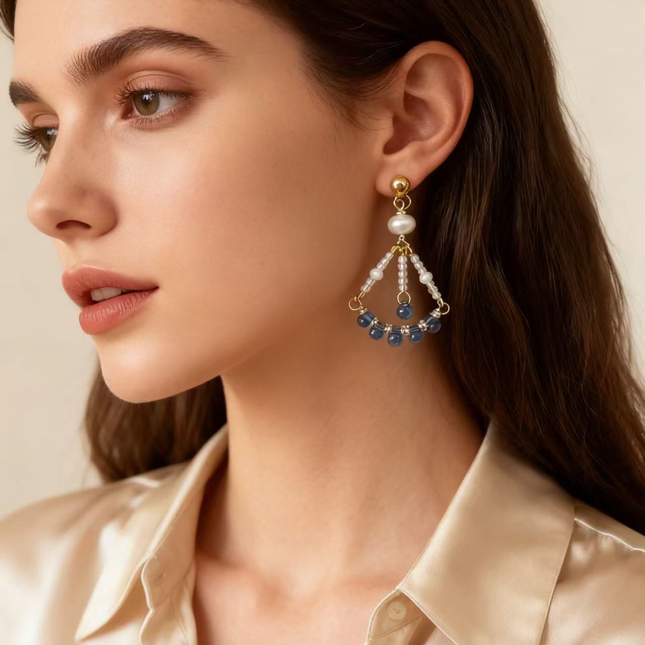 Elegant handmade drop earrings with pearl and blue bead details