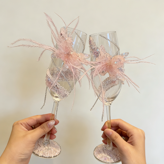 Blush feather butterfly champagne glasses with removable butterfly detail