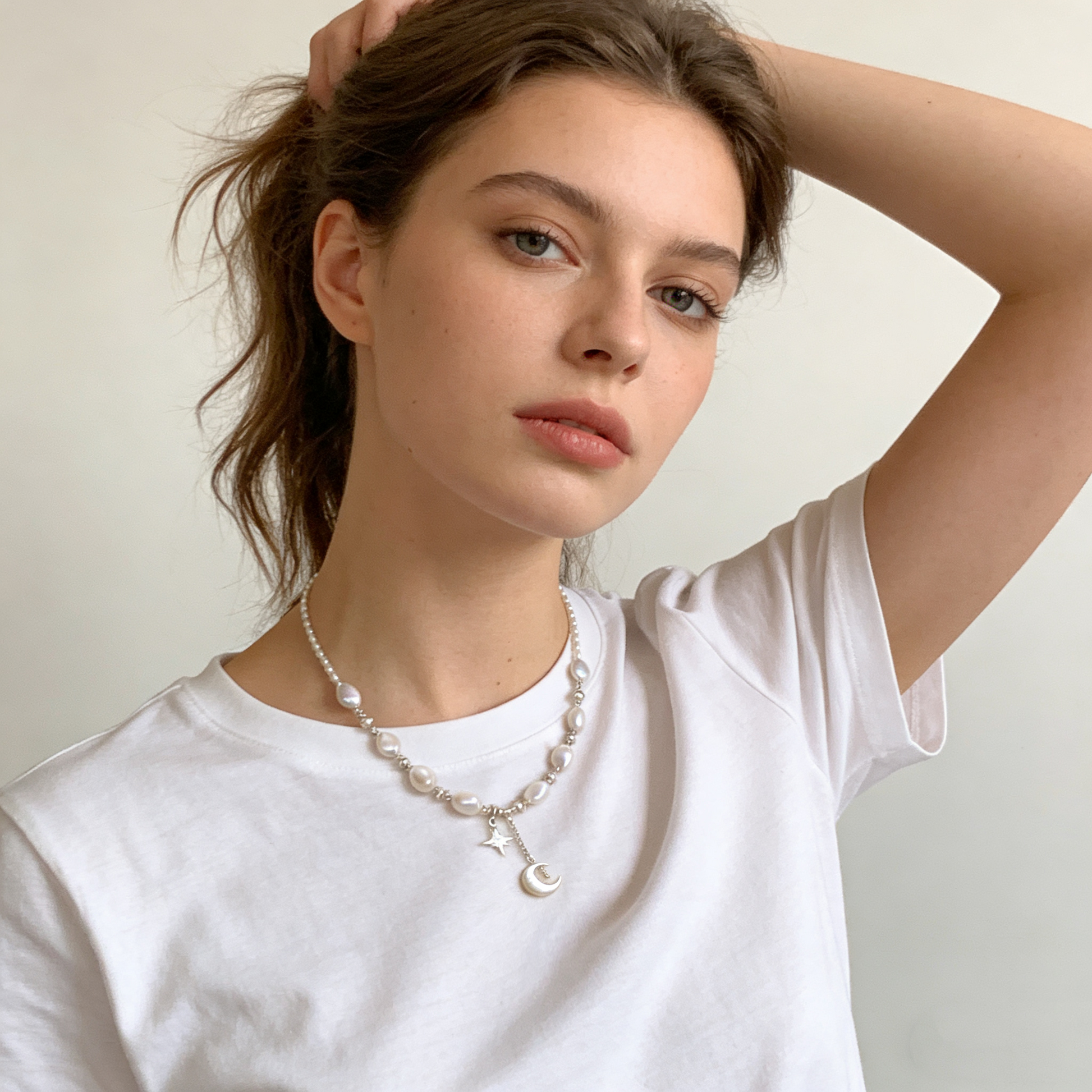 Elegant pearl necklace with mother of pearl moon