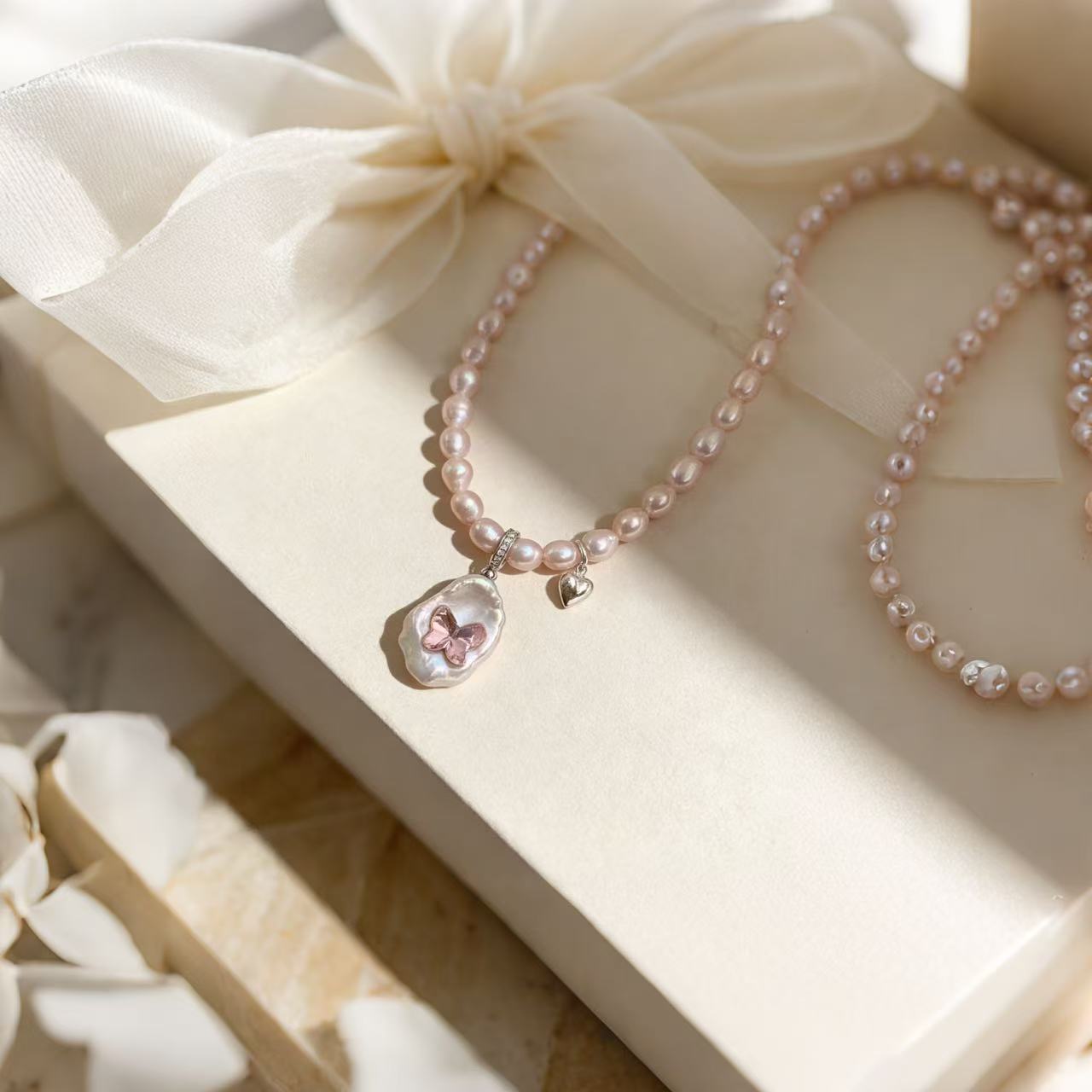 Handmade pink pearl necklace featuring natural baroque pearl