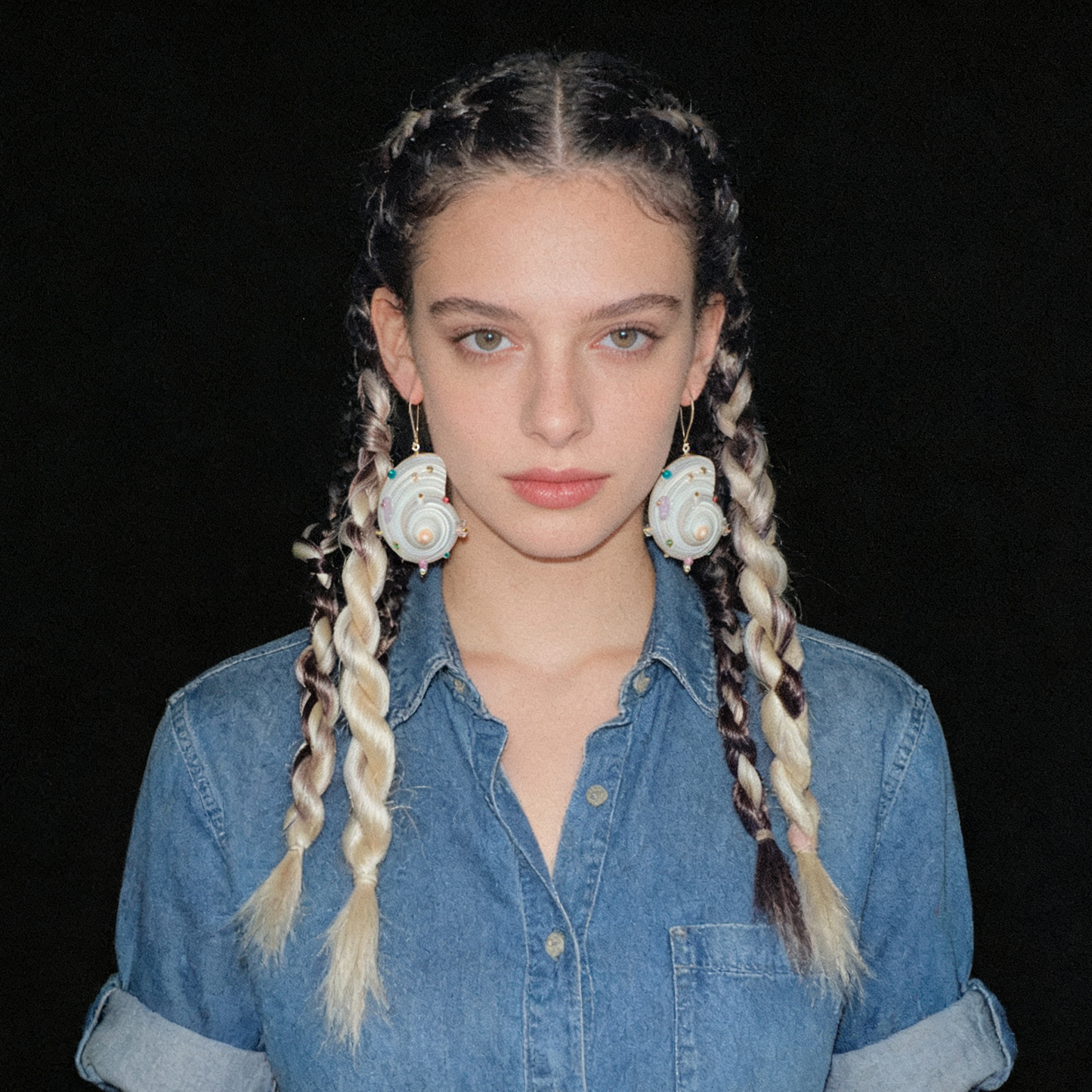 Handmade shell and pearl statement earrings with Swarovski® crystals worn on model