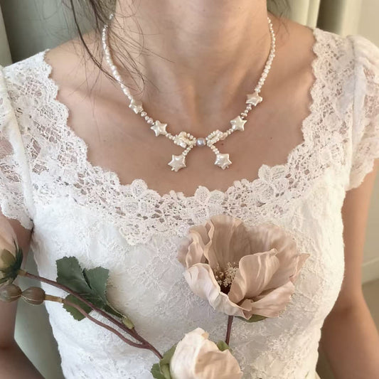 Handmade baroque pearl star necklace worn on model
