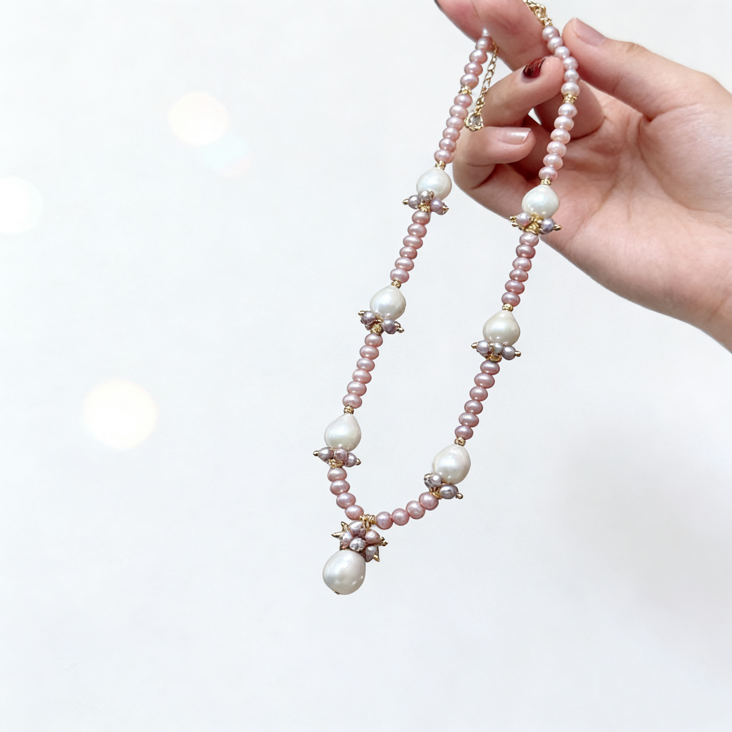 Natural pink pearl necklace with drop charm detail