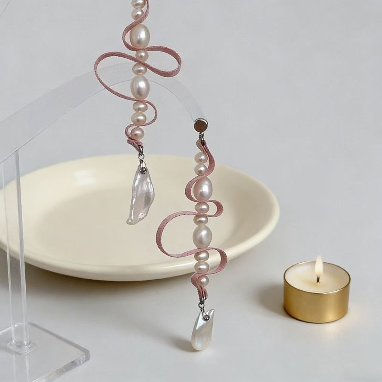Baroque pearl and soft pink ribbon detail on drop earrings