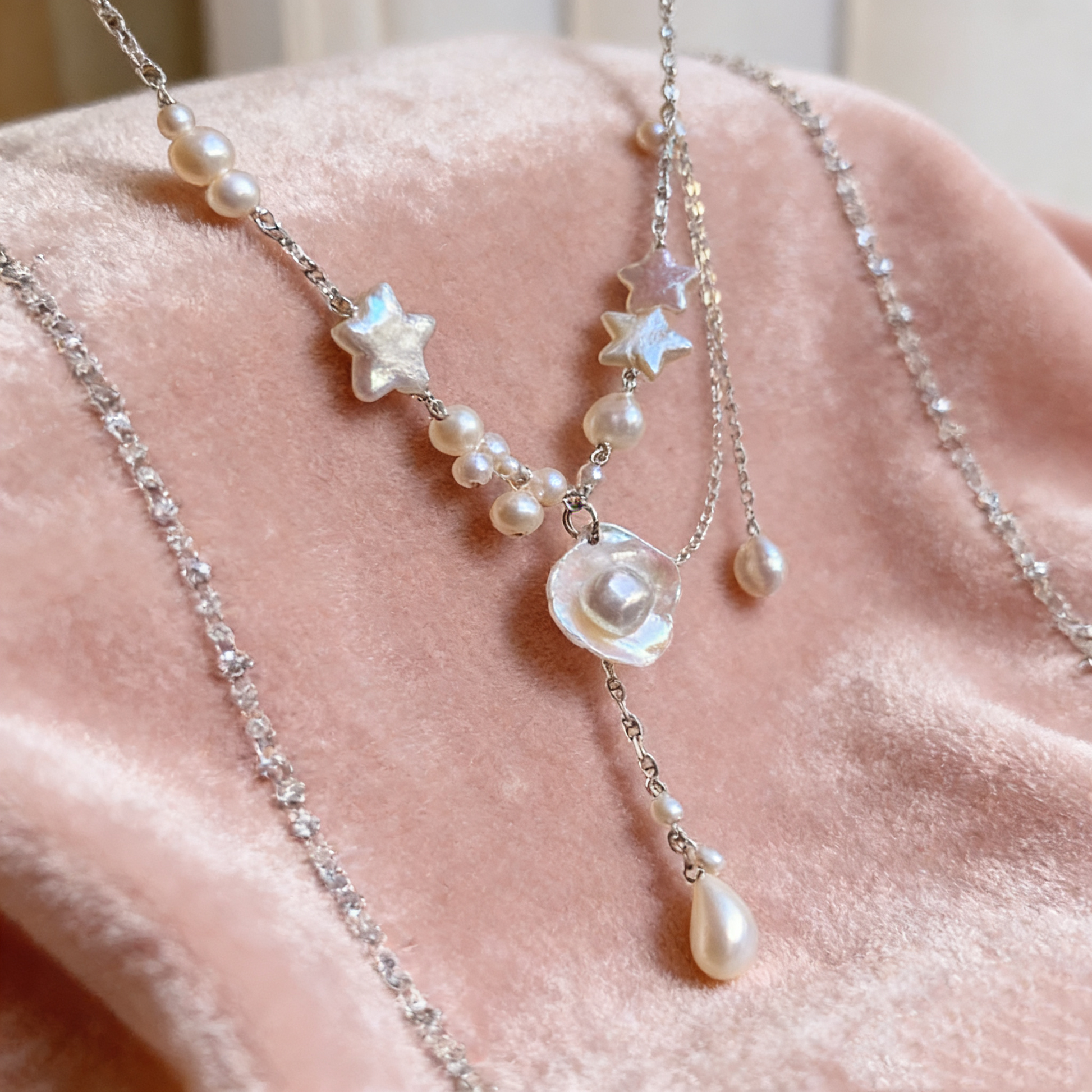 Double layer pearl necklace with star details and silver tone chain