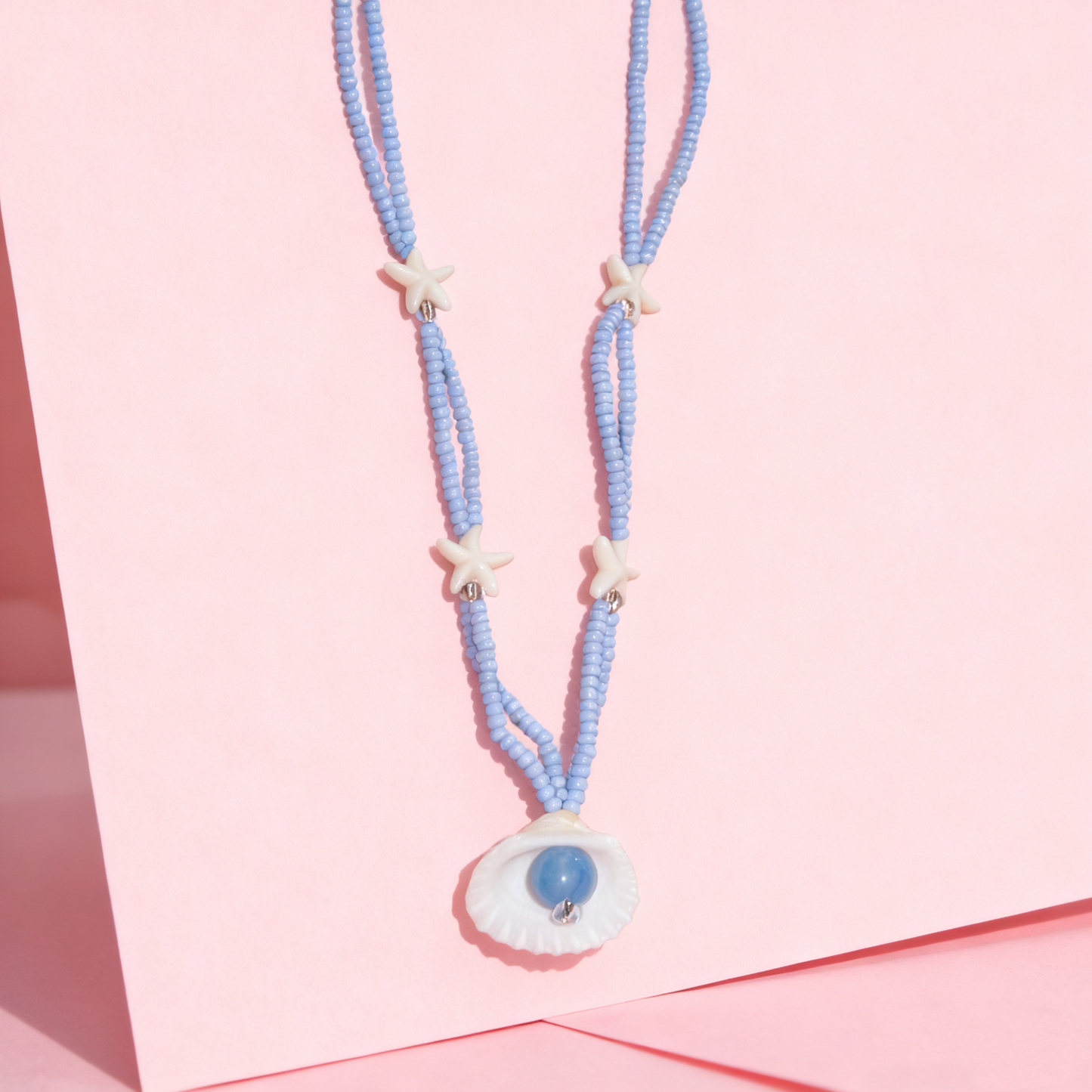 Soft blue starfish shell necklace designed for everyday wear