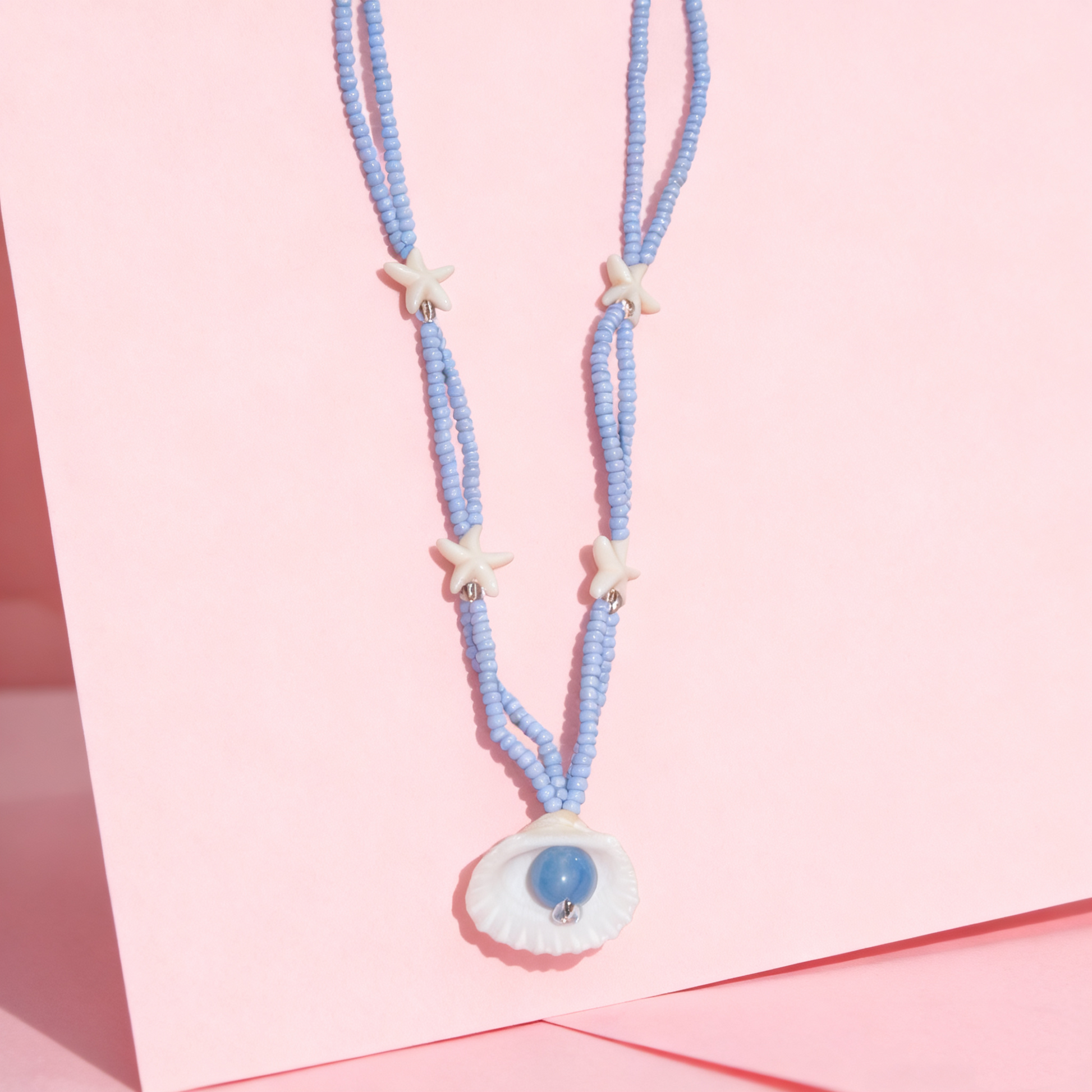 Soft blue starfish shell necklace designed for everyday wear