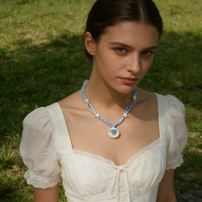 Starfish shell beaded necklace in soft blue with shell pendant