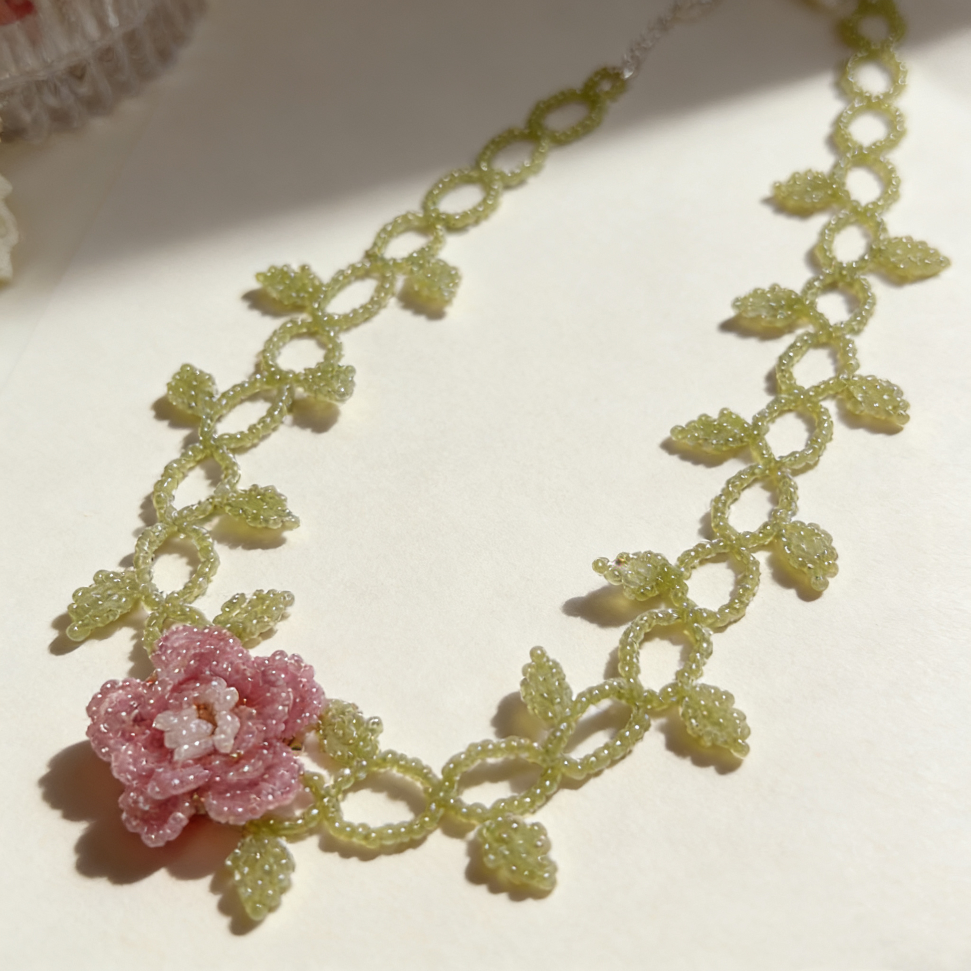 Detail view of glass seed beads and handmade construction