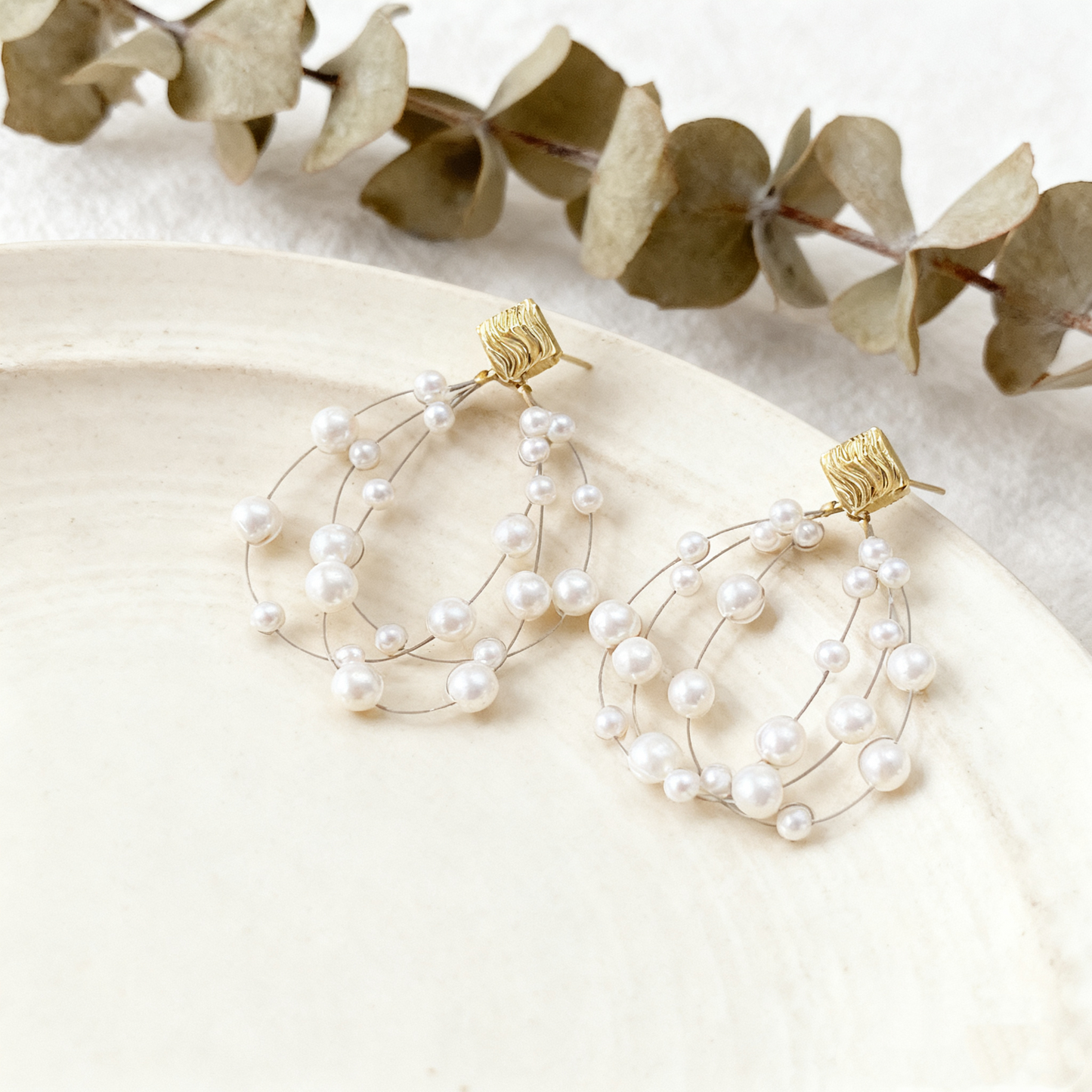 Modern Mabe pearl earrings with gold tone details