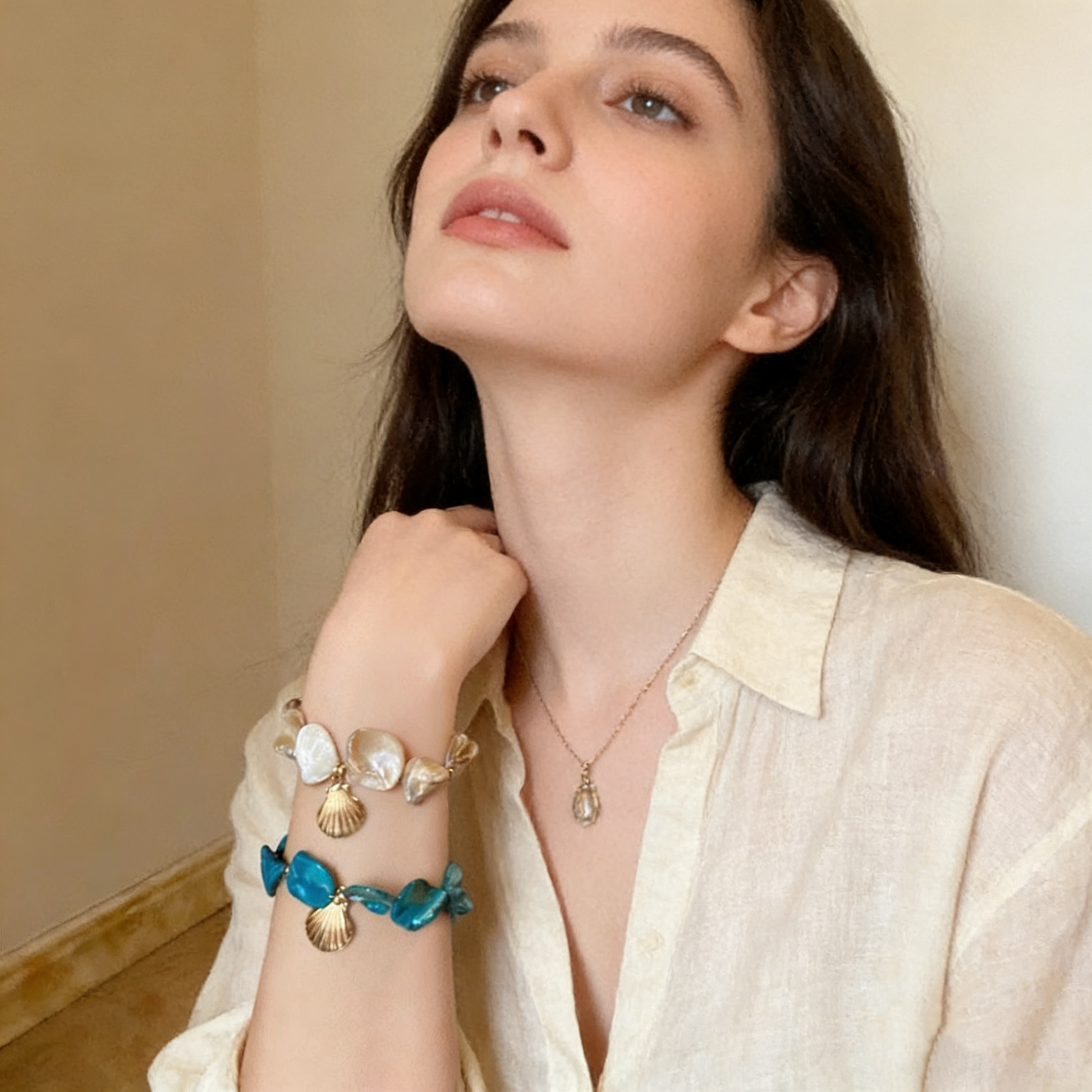 Abalone shell bracelet with copper charms close up