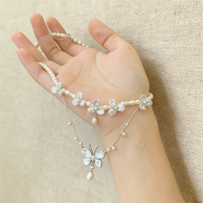 Elegant baroque pearl butterfly necklace on neckline