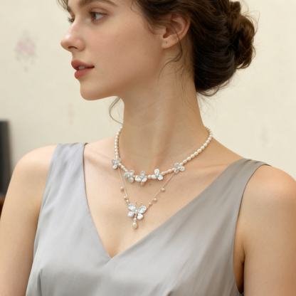 Handmade baroque pearl butterfly necklace flat lay