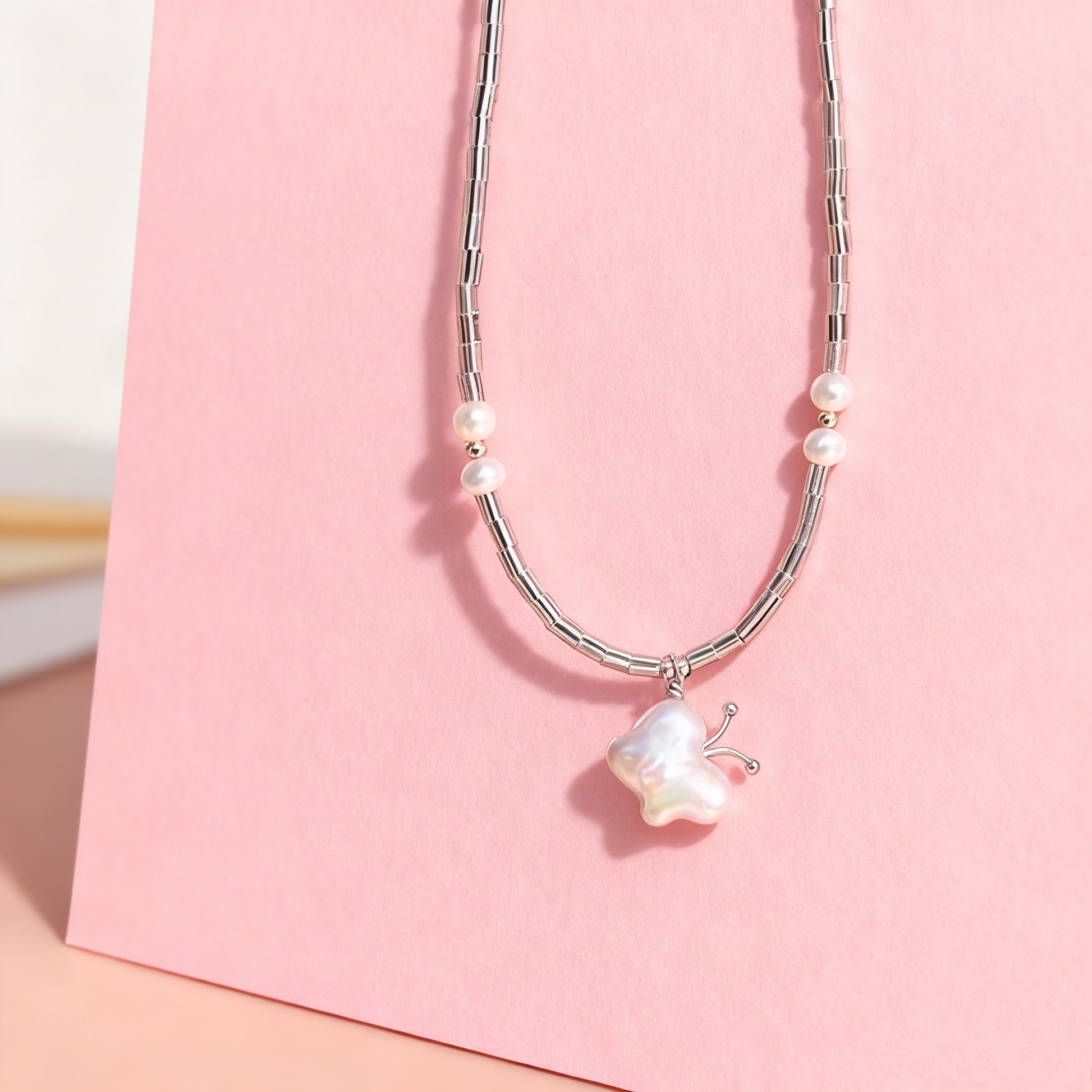 Natural baroque pearl butterfly necklace close up detail
