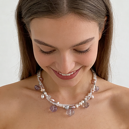 Handmade crystal and natural pearl charm necklace flat lay