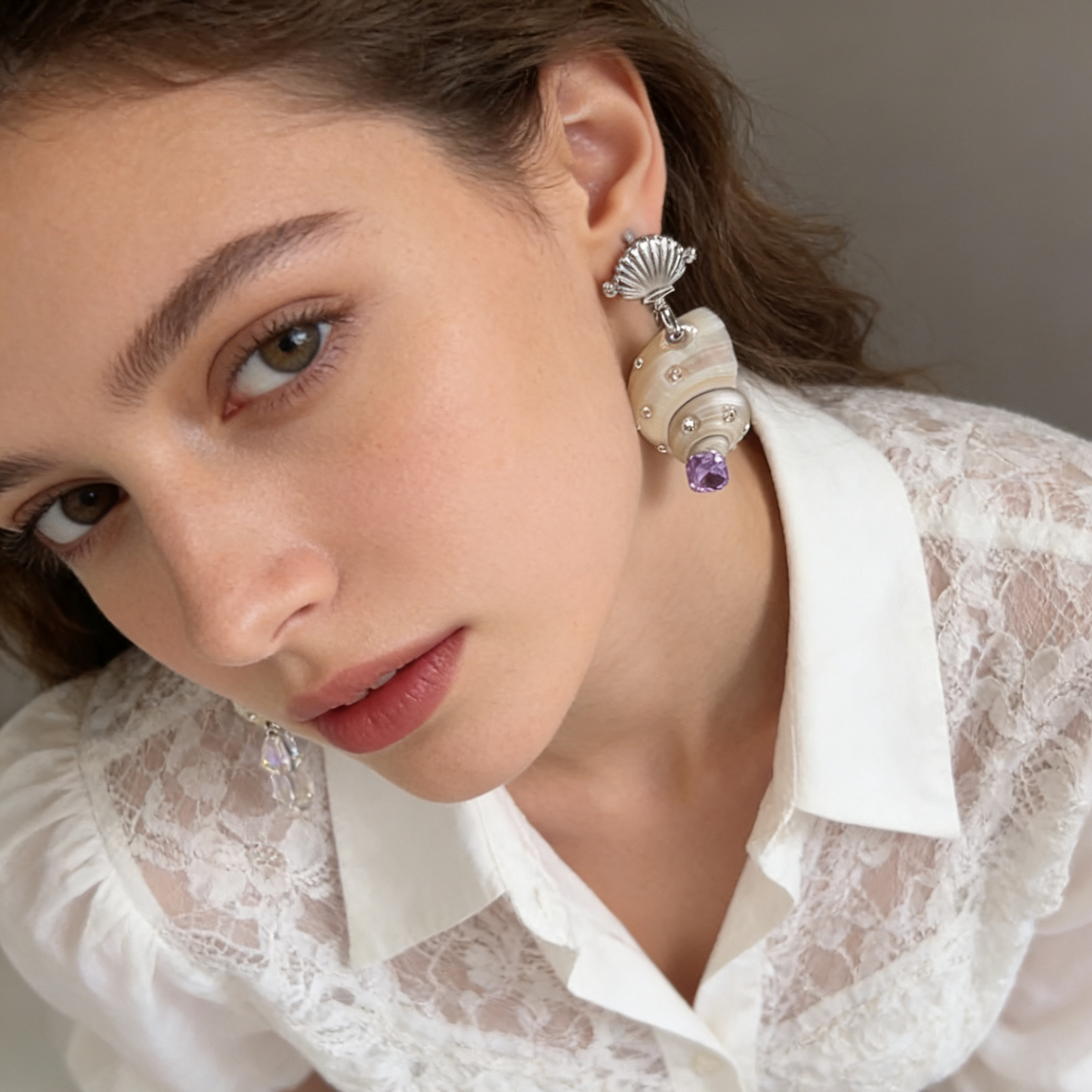 Elegant shell pearl earrings styled for everyday and evening wear