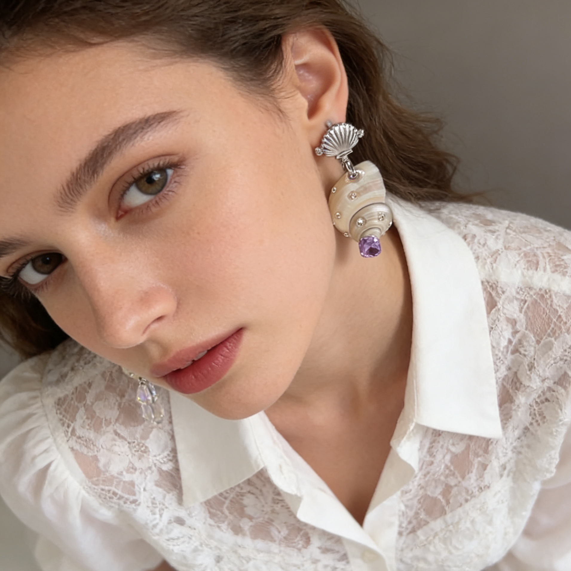 Elegant shell pearl earrings styled for everyday and evening wear