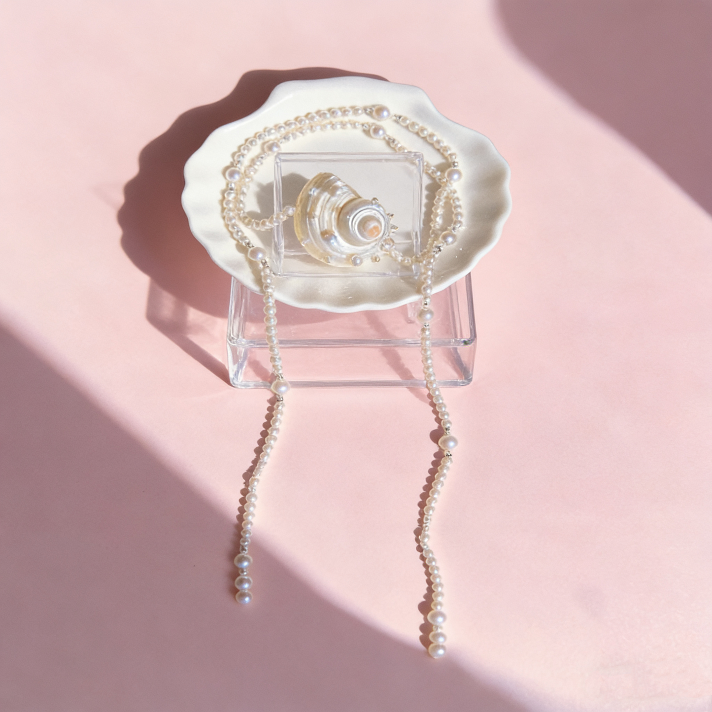 Handmade long pearl necklace featuring a real shell centerpiece