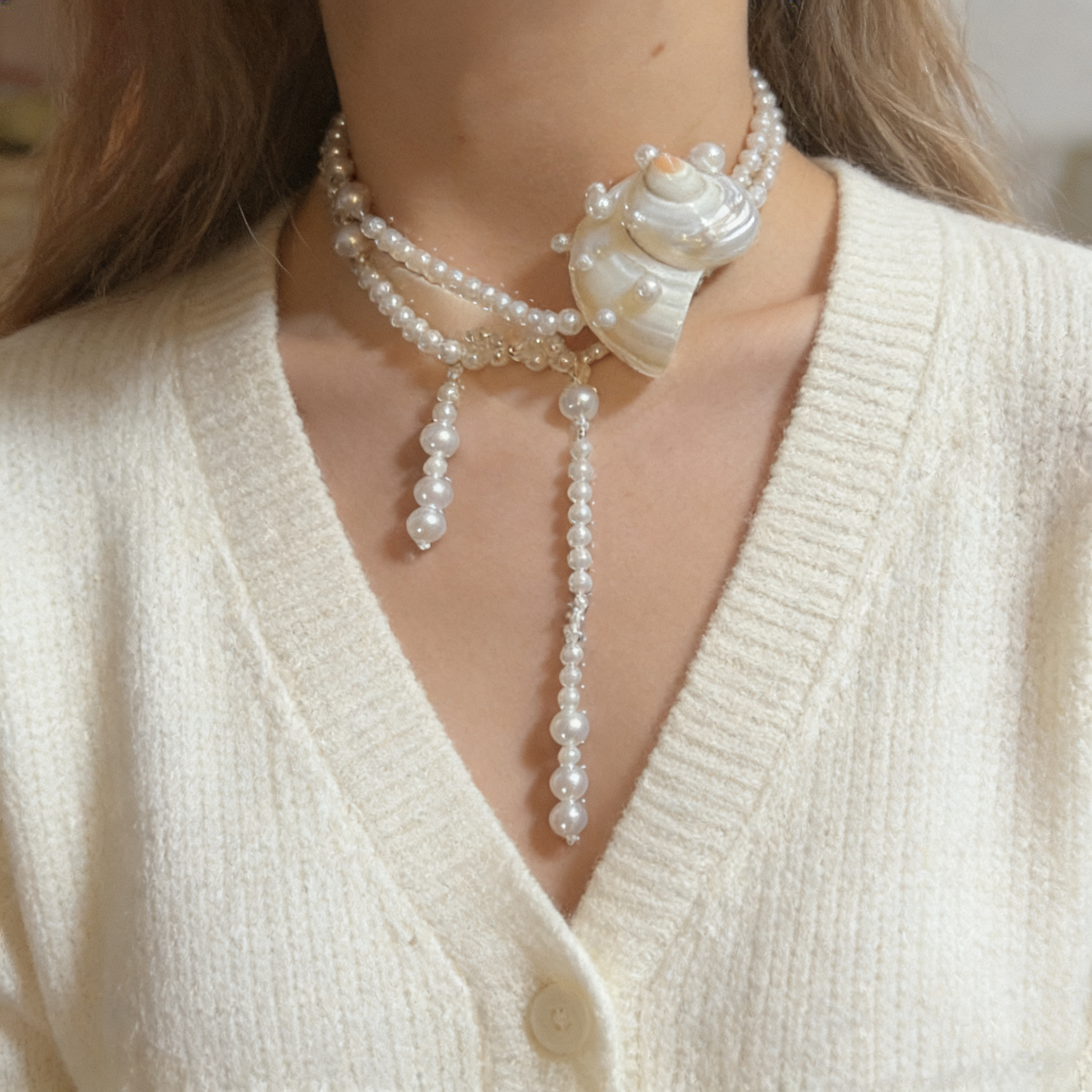 Elegant long pearl statement necklace with organic shell focal piece